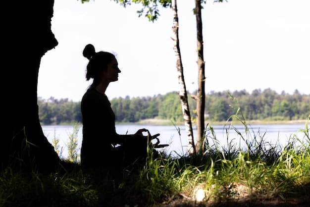 A person sitting peacefully in nature, meditating and acknowledging their emotions. Soft, natural light highlights calm and acceptance.
