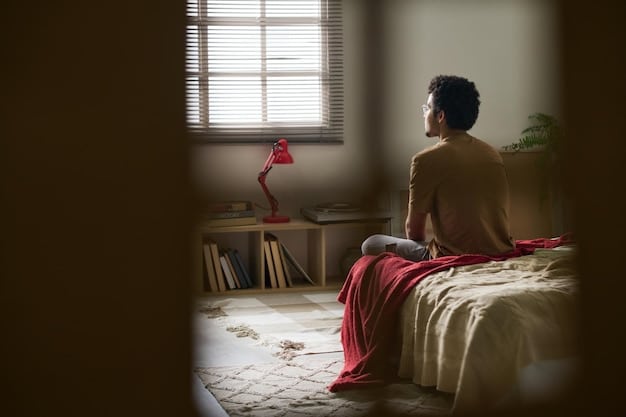 A person meditating in a quiet room, lit with soft, warm light. The room is simply decorated to promote mindfulness. The individual appears calm and composed, emphasizing the connection between emotional resilience and mindfulness practices.