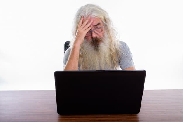 A stressed-looking person sitting in front of a computer, rubbing their temples in frustration. The lighting is harsh, and the atmosphere suggests a busy, overwhelming workplace, emphasizing the relationship between stress and sleep deprivation.