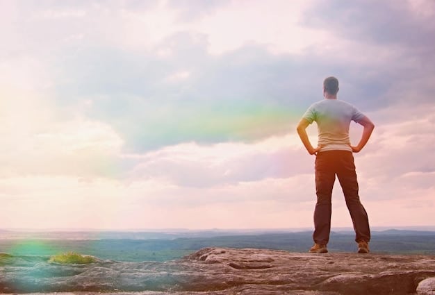 A person standing on a mountaintop, looking out at a vast landscape, symbolizing freedom and release after making the decision to forgive. The sky is clear and bright, representing hope and renewal.