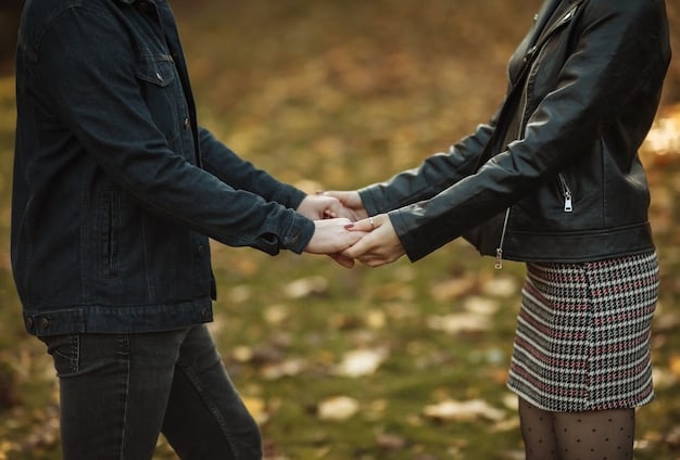 A couple holding hands and hugging. They appear to be in love and very connected as a couple. They are in a serene setting.
