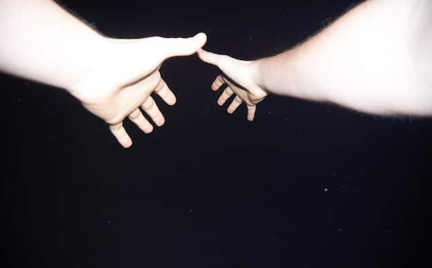 Two hands gently intertwined, symbolizing mutual respect and understanding of personal boundaries within a relationship. Soft lighting highlights the hands.