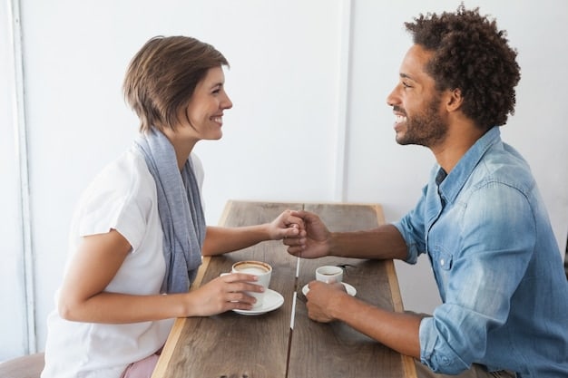 A couple sitting across from each other at a table, engaged in a heartfelt conversation. Their body language is open and attentive, with sincere eye contact and gentle smiles.