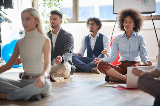 A diverse group of colleagues participating in a guided meditation session in a modern office space. They are seated comfortably on cushions, with soft, ambient lighting and a calming nature scene projected on the wall.
