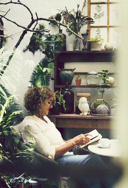 A person journaling in a cozy, brightly lit room. They are writing reflectively, surrounded by plants and soft textures, promoting an atmosphere of introspection and self-care.