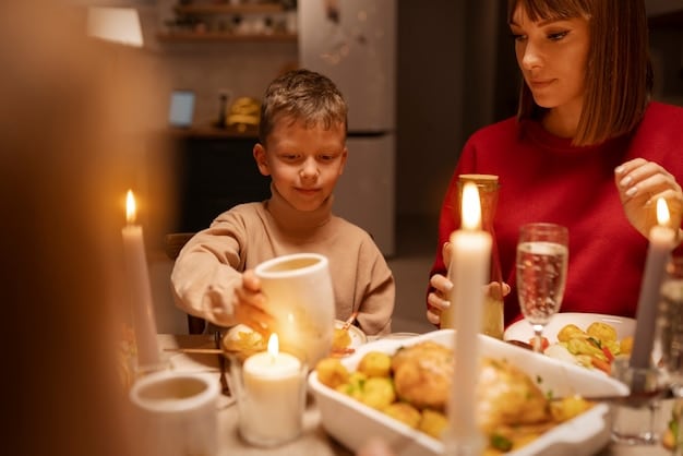 A family having dinner together at a dining table, with all devices put away in a separate basket. The scene is warm and inviting, with candles lit on the table.