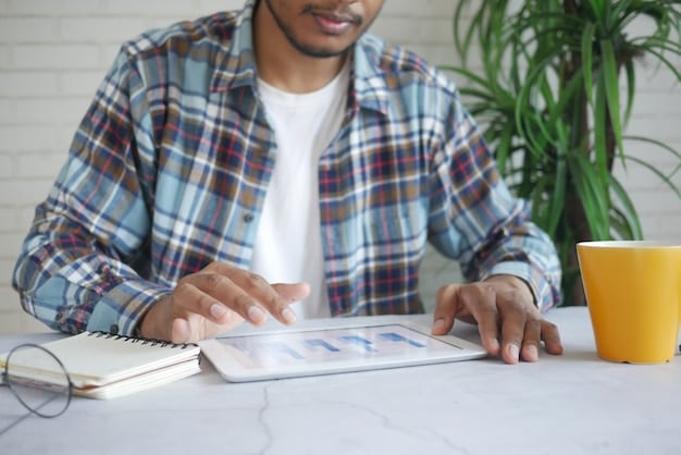 A person using a budgeting app on a tablet, showing a clear breakdown of income, expenses, and savings goals.