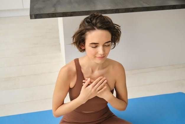 A close-up shot of a person's hand gently resting on their chest while meditating, emphasizing the connection between mind and body and the calming effect of mindfulness practices. The background is softly blurred, creating a sense of peace and serenity.