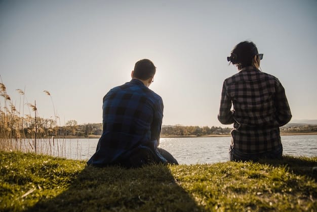 Two people sitting across from each other, engaged in deep conversation, with visible cues of active listening such as eye contact, nodding, and leaning in, set against a backdrop of natural sunlight.