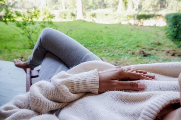 A close-up of a person's hands gently resting on their lap, relaxed, in a calming environment, ready to begin mindful breathing exercises.