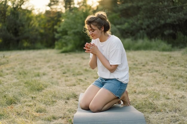 A person sitting cross-legged in a peaceful outdoor setting, meditating with hands resting on knees, breathing calmly in and out with a gentle smile.