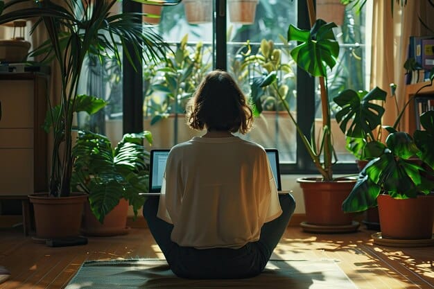 A person meditating in their office during a break, surrounded by plants and natural light, showcasing the integration of meditation into a typical workday.