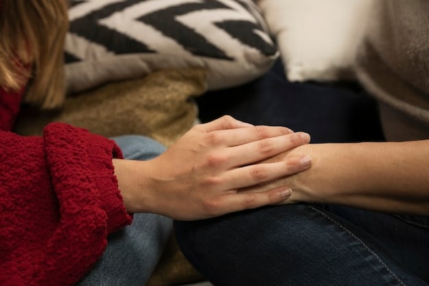 A close-up shot of two family members holding hands during a therapy session, symbolizing support and connection. The focus is on their hands and the sense of unity.