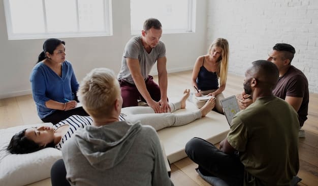 A group of people sitting in a circle, participating in a group therapy session. A therapist is leading the discussion, and the participants appear engaged and supportive of each other.