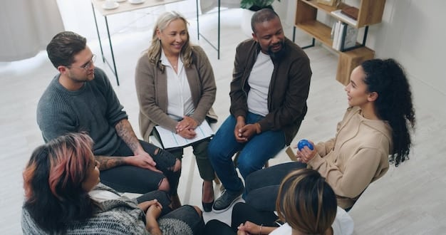 A group of people sitting in a circle during a support group meeting, showing camaraderie and shared understanding.