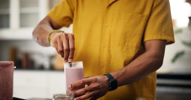 A person drinking a smoothie made with fruits, vegetables, and protein powder, illustrating a healthy and convenient way to support nutritional needs during addiction recovery.