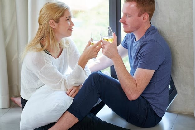 A couple sitting face-to-face, deeply engaged in conversation. The woman is gently holding the man's hand, and her eyes are filled with compassion. The background is blurred, emphasizing their connection and the safe space they've created for open dialogue.