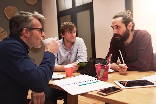 A mentor guiding a younger employee in a one-on-one meeting, showcasing the value of mentorship in building confidence and providing career guidance.