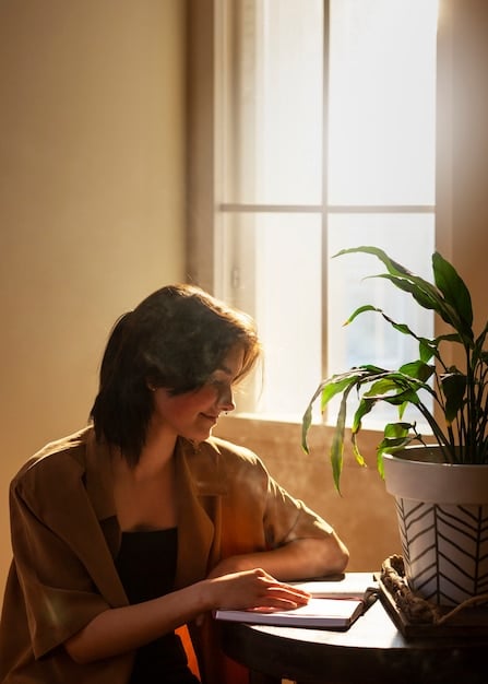 Someone is calmly journaling in a quiet room, sunlight coming from behind, representing the process of emotional awareness and acknowledgment.