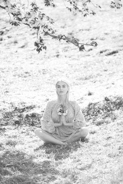 A person meditating in a peaceful setting, surrounded by supportive and comforting symbols. The image evokes a sense of calm, mindfulness, and emotional balance.