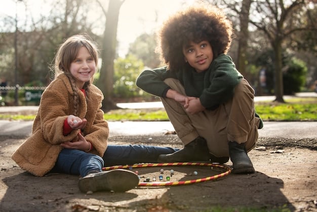 A group of diverse children playing together outdoors, some laughing while others are helping each other climb a small hill. The scene conveys teamwork, joy, and overcoming challenges together, reinforcing the concept of building emotional resilience.