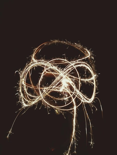 A brain depicted with tangled thoughts being untangled by hands, metaphorically representing cognitive restructuring and mental clarity.