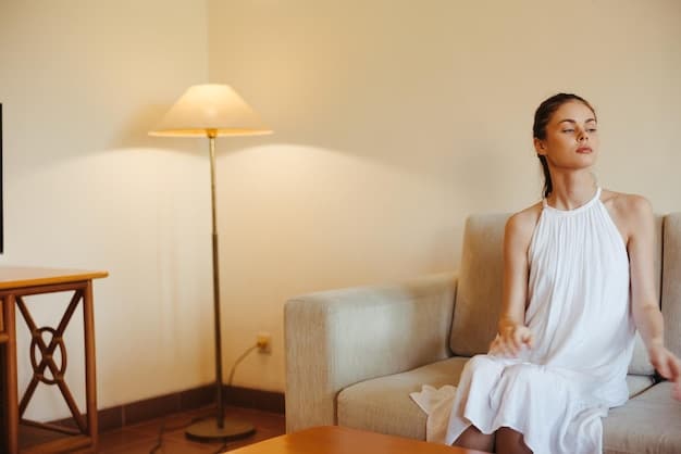 A person sitting in a comfortable position, eyes closed, meditating in a serene room with soft lighting and minimal distractions. The image should evoke calmness, focus, and inner peace.