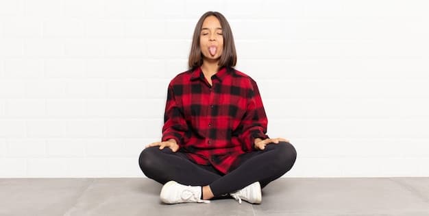 A person sitting comfortably with their eyes closed, demonstrating proper posture for mindful breathing. Their hands are resting gently on their lap, and their back is straight. Soft, natural lighting and a focus on relaxation.