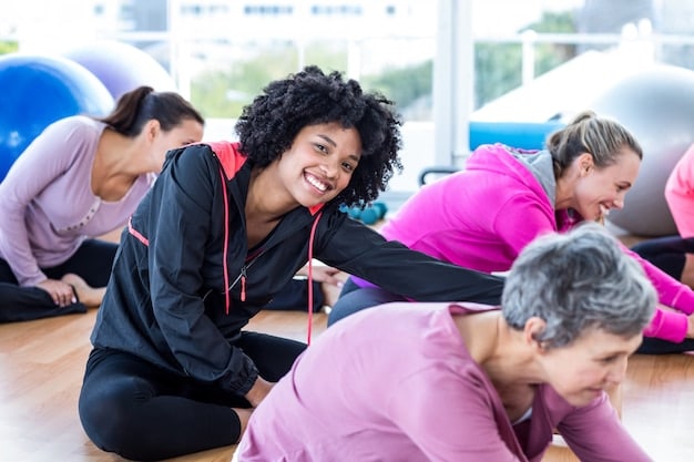 A diverse group of people participating in a group fitness class, with an instructor leading the session. The atmosphere is energetic and motivating, showcasing the social aspect of exercise.