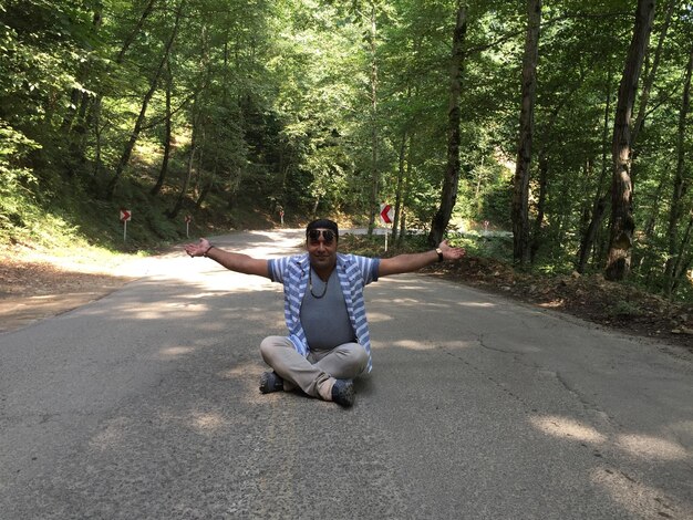 A person practicing yoga or meditation outdoors, illustrating a healthy coping mechanism for stress and cravings during addiction recovery.