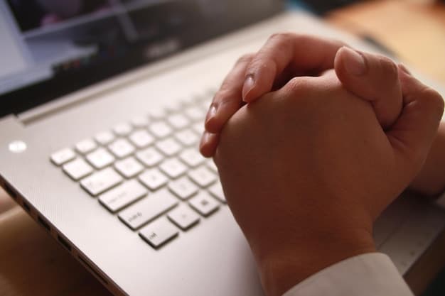 A close-up of a person's hands typing on a keyboard, with a blurred background showing a busy office environment. The focus is on the hands and keyboard, symbolizing the act of working and productivity.