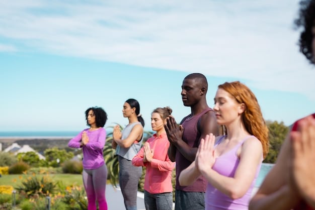 A diverse group of people participating in a team-building exercise outdoors, with smiles on their faces. The image conveys a sense of collaboration, support, and positive energy.